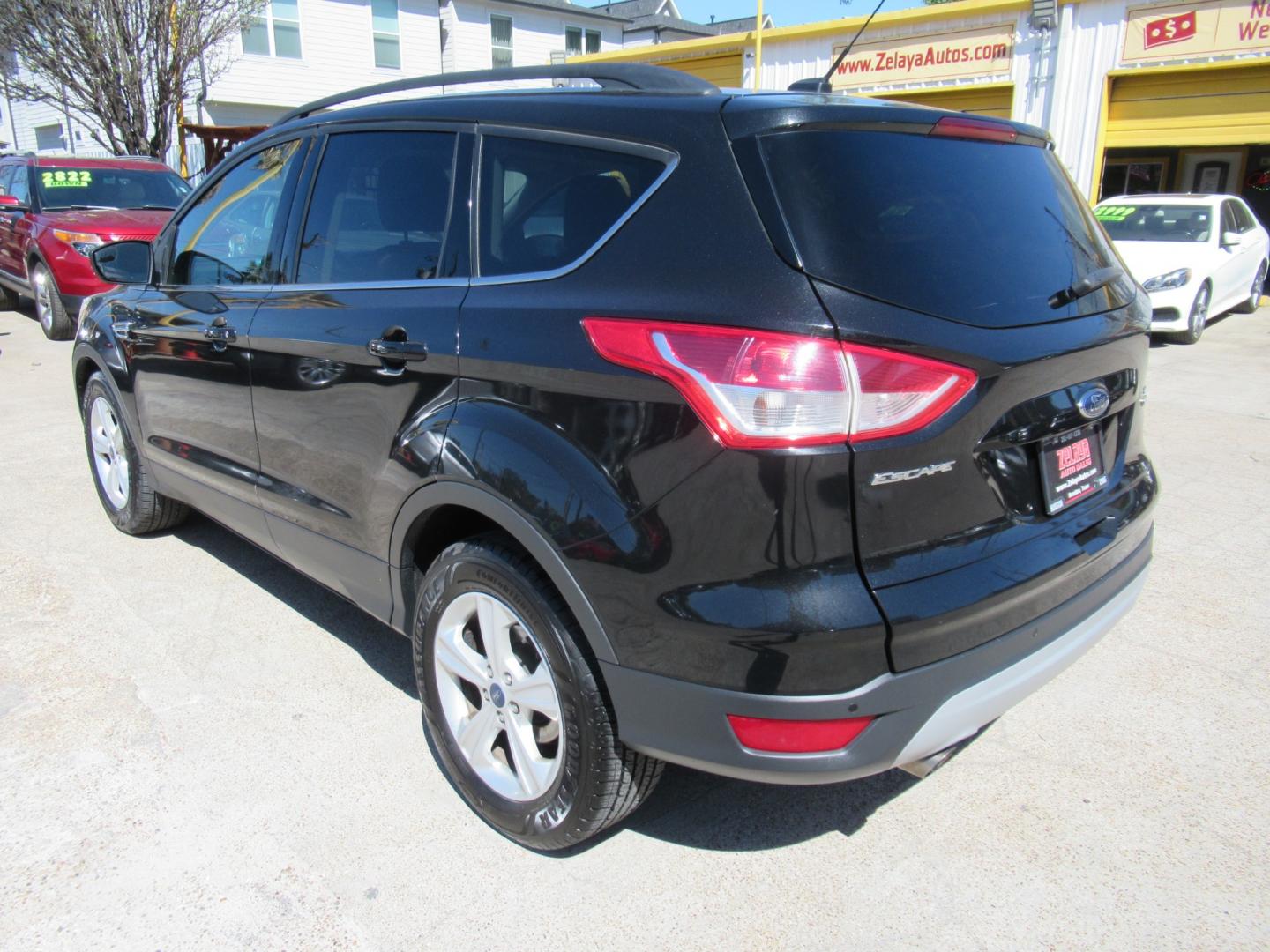 2014 Black /Black Ford Escape SE 4WD (1FMCU9GX5EU) with an 1.6L L4 DOHC 16V engine, Automatic transmission, located at 1511 North Shepherd Dr., Houston, TX, 77008, (281) 657-1221, 29.798361, -95.412560 - 2014 FORD ESCAPE SE VIN: 1FMCU9GX5EUC37295 1 F M C U 9 G X 5 E U C 3 7 2 9 5 4 DOOR WAGON/SPORT UTILITY 1.6L I4 F DOHC 16V GASOLINE FRONT WHEEL DRIVE W/ 4X4 - Photo#25